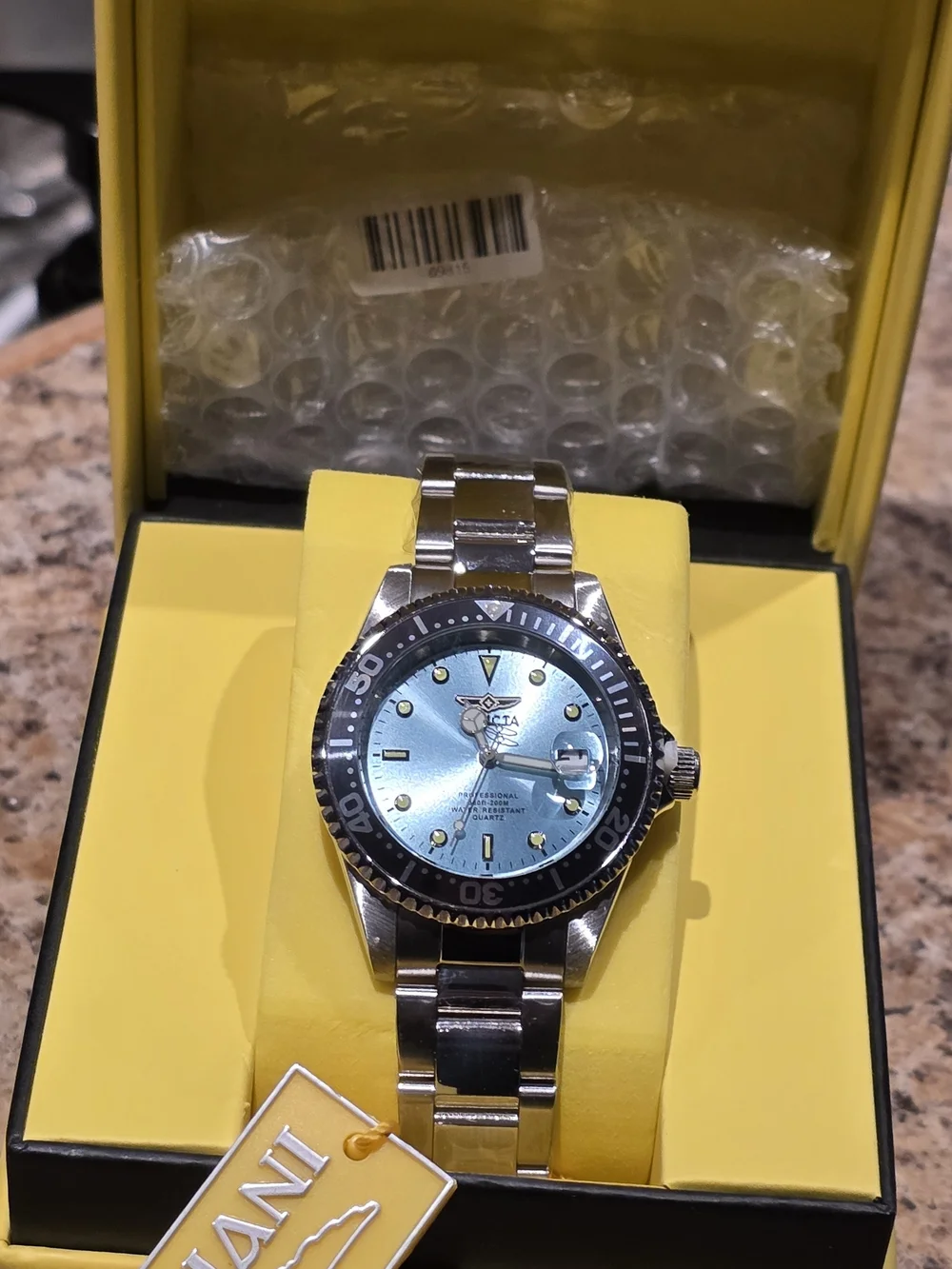 Invicta Men's Silver Stainless Steel Watch with Blue Dial and Black Bezel
